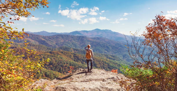 istock Man at the edge of a cliff 1136383266