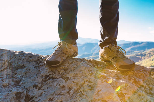 istock Man at the edge of a cliff 1136383342
