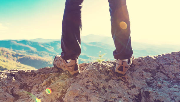 istock Man at the edge of a cliff 1136383345