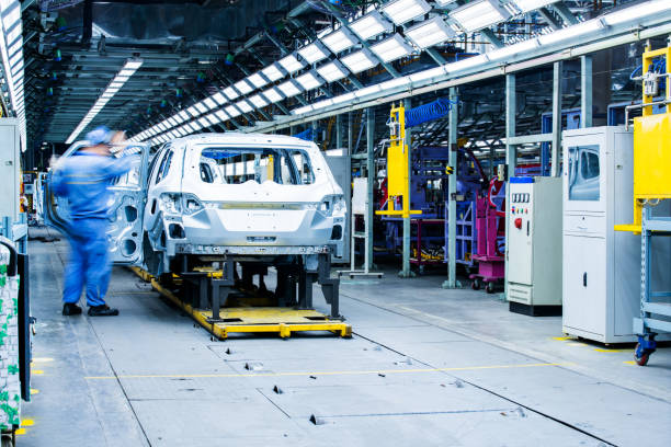 istock Welding robots movement in a car factory 1136383481