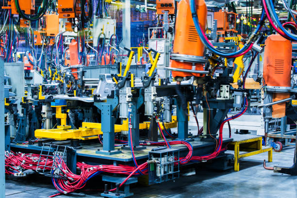 istock Welding robots movement in a car factory 1136383578