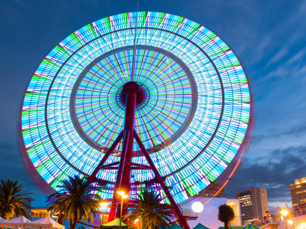 istock Beautiful Ferris Wheel Spinning Long Exposure Neons. 1136383595