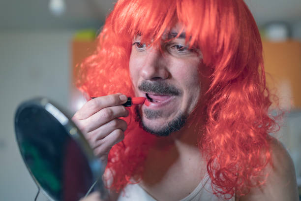 istock Bisexual Person Doing a Makeup at Home 1136383625