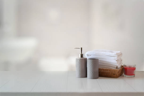 istock Ceramics shampoo or soap, Towels on top marble counter with copy space on bathroom background. 1136385157