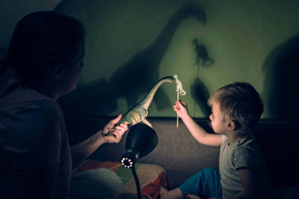 istock Mother and adorable son playing with shadows 1136385563