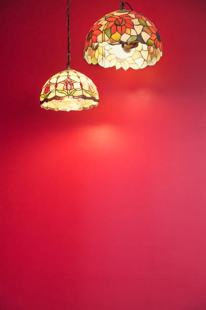 istock Red wall with light of lamp 1136385619