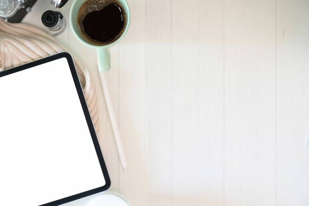 istock Mock up tablet on stylish desk workplace with supplies and copy space 1136385667