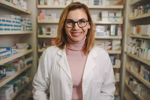 istock Confident female pharmacist on drug store 1136387343