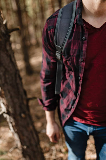 istock Young man trail hiking in the forest. 1136387537