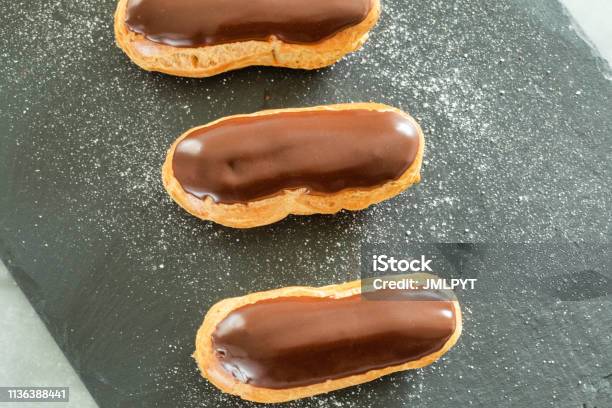 Traditional French Pastry Aerial View Of Eclair With Chocolate Icing Stock Photo - Download Image Now