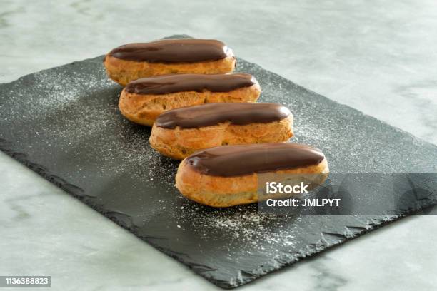 Traditional French Pastry Eclair With Chocolate Icing Stock Photo - Download Image Now