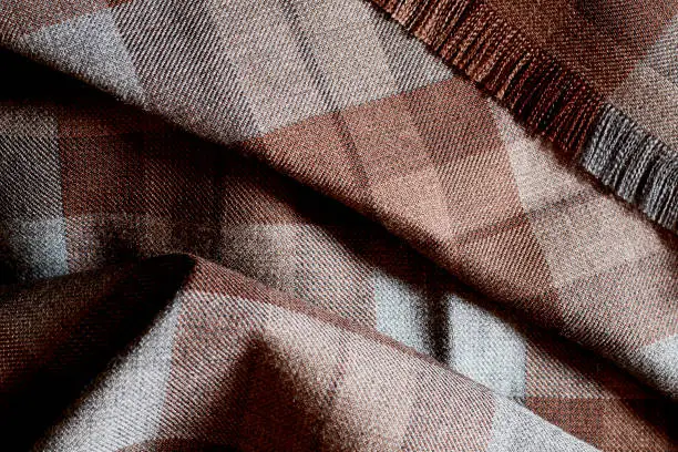 Close up of brown based Scottish tartan.