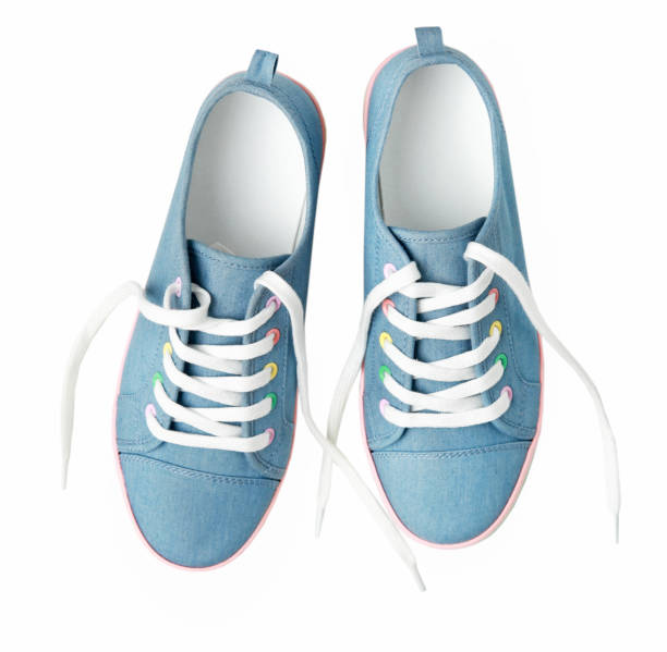 istock Blue jean sneakers shoes pair isolated 1136389039