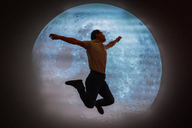 istock Asian Man jumping to the moon 1136390573
