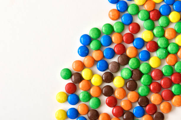 istock sweet colorful chocolate candies on white background 1136392015
