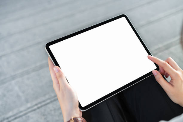 istock Hand holding tablet blank screen on isolated. Take your screen to put on advertising. 1136393674