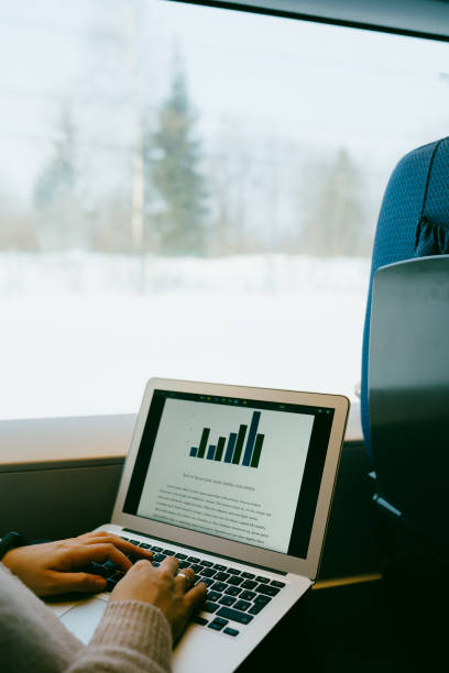 istock Typing using laptop computer in the train. Business work travel 1136395843