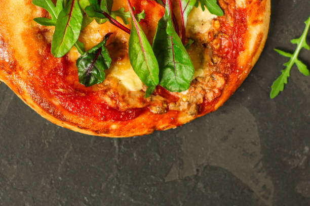 istock pizza, mushrooms, chicken, tomato sauce, cheese, (pizza ingredients and microgreen). hot pizza. Top view. copy space 1136397302