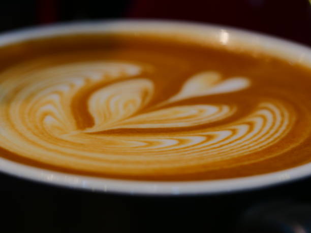 istock Cup of latte coffee and spoon on gray counter 1136397358
