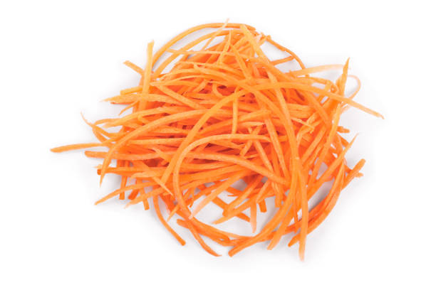 istock fresh shredded carrots isolated on white background, Top view. Flat lay 1136397675