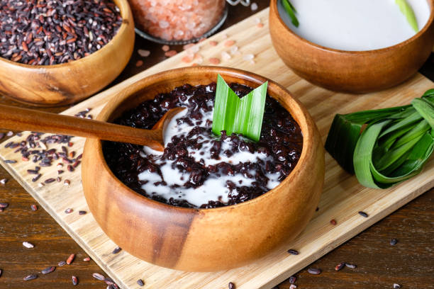 Cooked black sticky rice with coconut milk stock photo