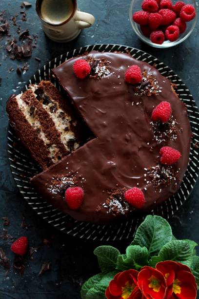 istock Chocolate cake with fruits on a plate over dark background. 1136402758