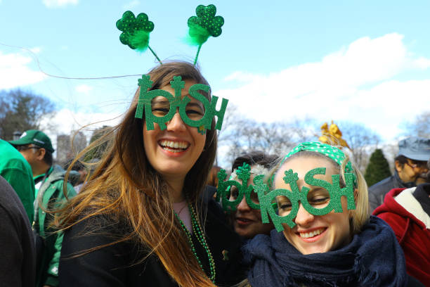 NEW YORK, NY - MARCH 16: People show off shamrock eyewear  along Fifth Ave. during the St. Patrick's Day Parade; March 16, 2019 in New York. (Photo by Gordon Donovan/iStockphoto via Getty Images)\