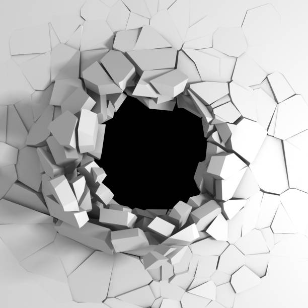 istock Dark destruction cracked hole in white stone wall 1136404500