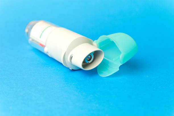 closeup of a spacer, asthma inhaler isolated on white background and copy space