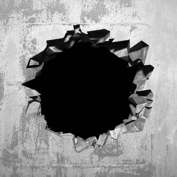 istock Dark cracked broken hole in concrete wall 1136407760