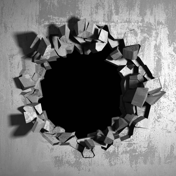 istock Dark cracked broken hole in concrete wall 1136408371