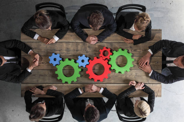 istock Business people with cogs of business 1136408773