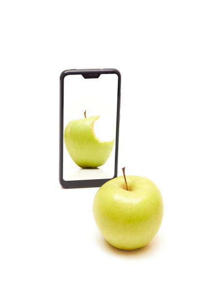Apple' selfie Apple makes selfie with smartphone apple with bite out of it stock pictures, royalty-free photos & images