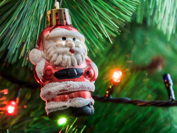 istock Santa Claus toy hanging on Christmas tree 1136411662