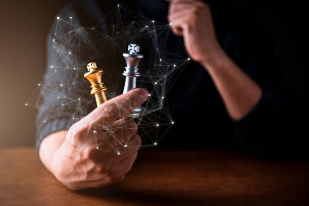 istock business decision strategy man hand chess with think action pose black background 1136411700