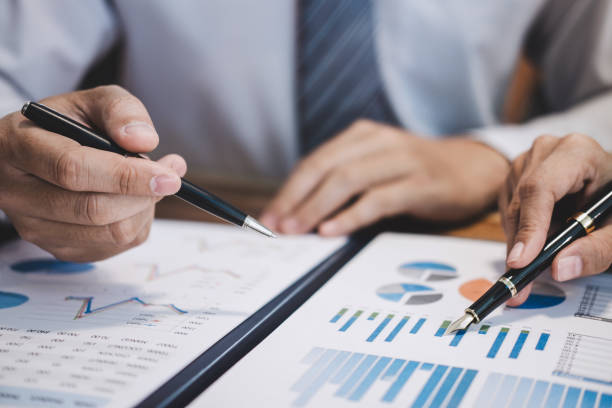 istock Business team working with new startup project plan and discussion information for financial strategy with laptop and digital tablet in a modern business lounge 1136413094