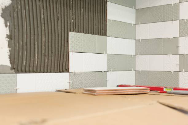 istock Process of laying ceramic tiles, construction and repair in the kitchen, tiles, tools 1136413281