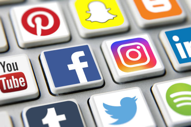 Social media icons internet app application London, UK - 03 17 2019: Social media icons printed and placed on computer keyboard applications Facebook, Twitter, Instagram, Youtube, Pinterest, Snapchat etc. brand name photos stock pictures, royalty-free photos & images