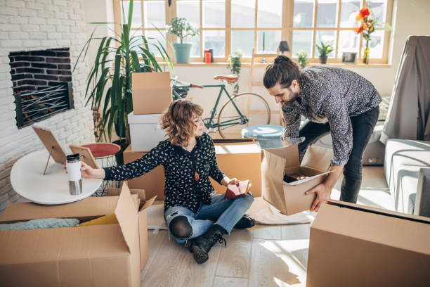 istock Happy couple moving in into new house 1136415079