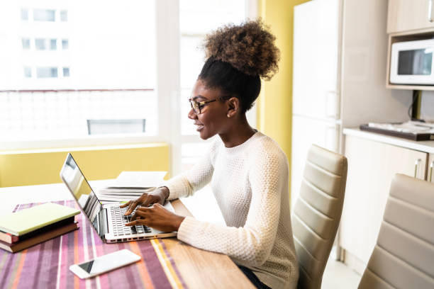 istock Woman sitting at home and studying 1136416072