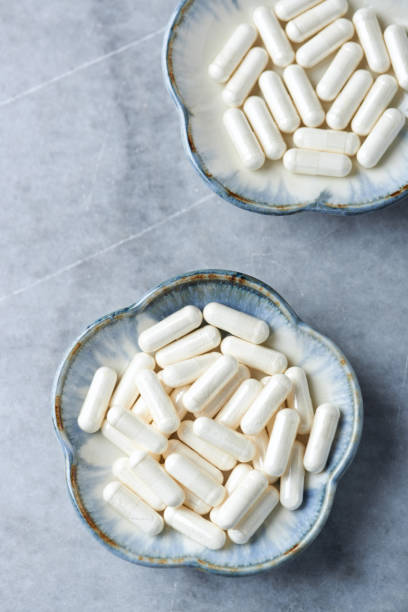 istock Piperine (black pepper extract). Immune System Support. Concept for a healthy dietary supplementation. Bright stone background. Directly above. Copy space. 1136416440