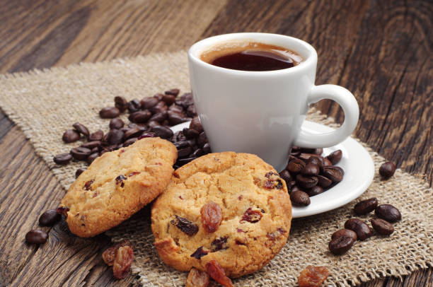 istock Cup of coffee and cookies with raisins 1136419362