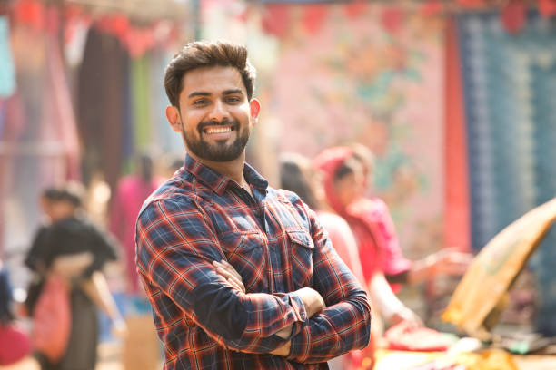 istock Young man at street market 1136419487