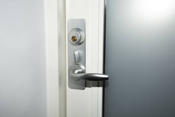 istock Close up view of lock on white door. Interior design. Beautiful backkgrounds. 1136419730