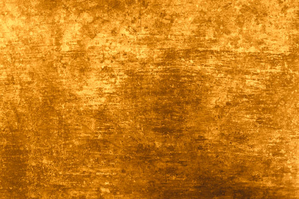 istock Texture natural plaster gold color. Background wall is natural concrete and stone. Rectangular size photo. 1136420057