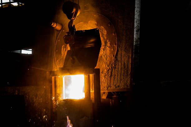 istock metal casting process with red high temperature fire in metal part factory 1136421436