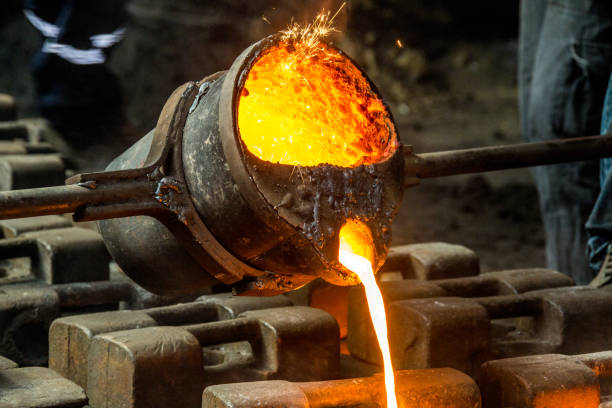 istock metal casting process with red high temperature fire in metal part factory 1136421441