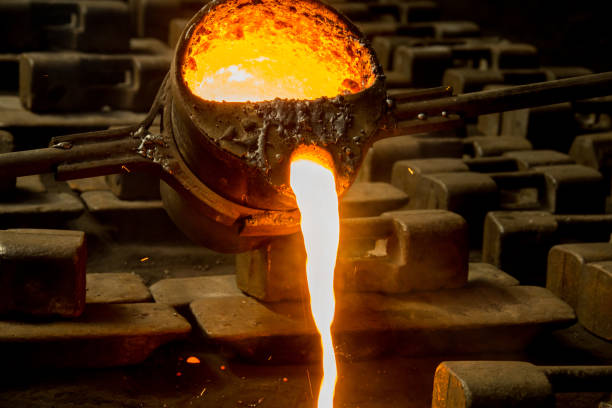 istock metal casting process with red high temperature fire in metal part factory 1136421446