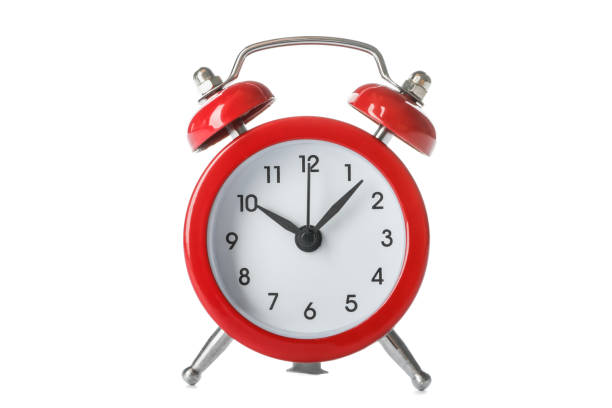 istock Beautiful retro alarm clock isolated on white background 1136422653