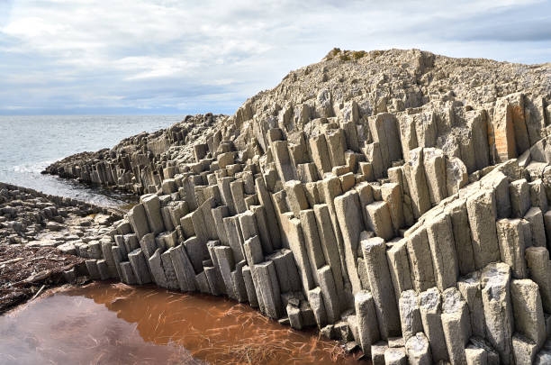 istock Rocky coast, volcanic rock formation, Kunashir island, cape Stolbchaty 1136424107